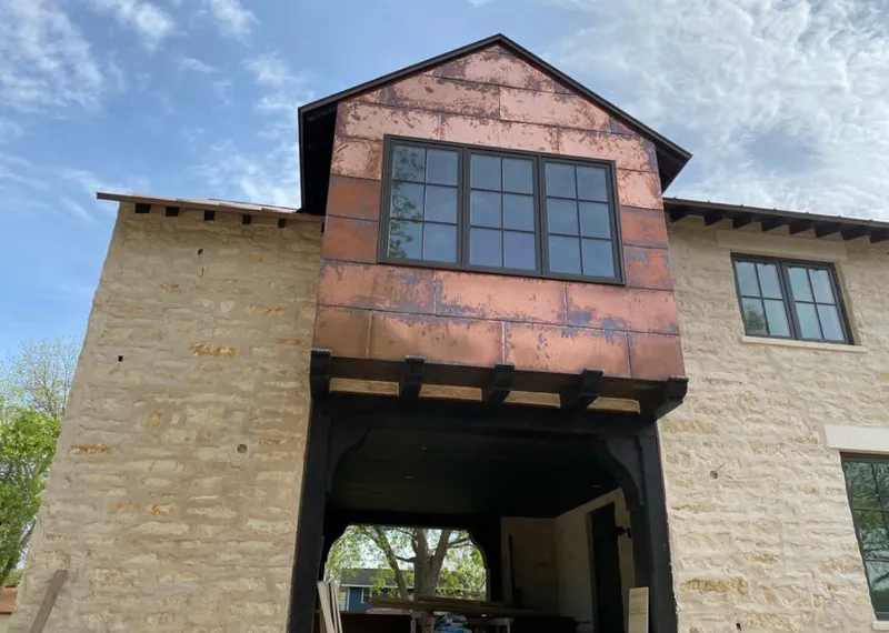 Copper metal panel facade on a stone building for Skylight Installation in Peach Bottom